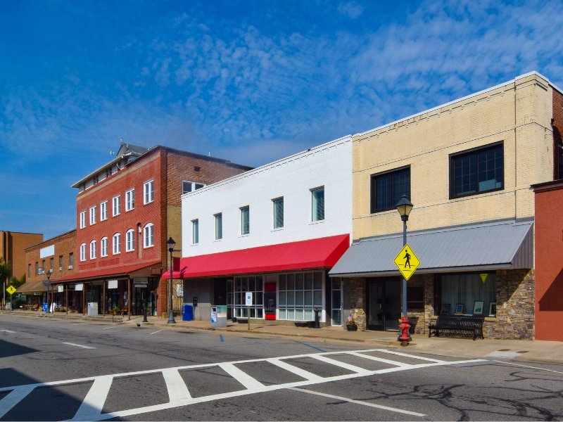 An empty street and closed businesses illustrate how rising crime can push communities into even greater poverty and lack of opportunity.