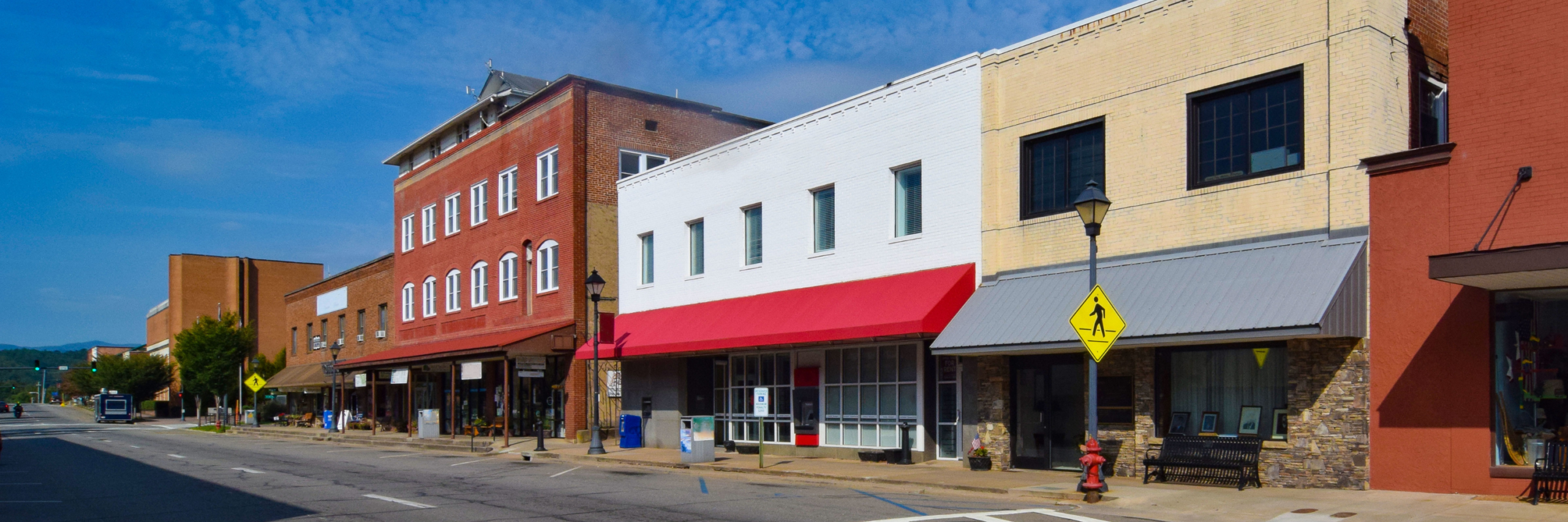 An empty street and closed businesses illustrate the real-life impact of crime on poverty in a community. 