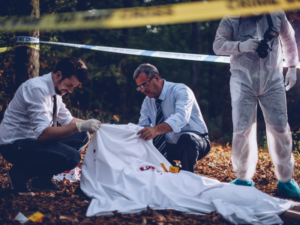Photo of coroner looking at murder victim