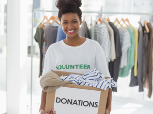 a volunteer with a donation box