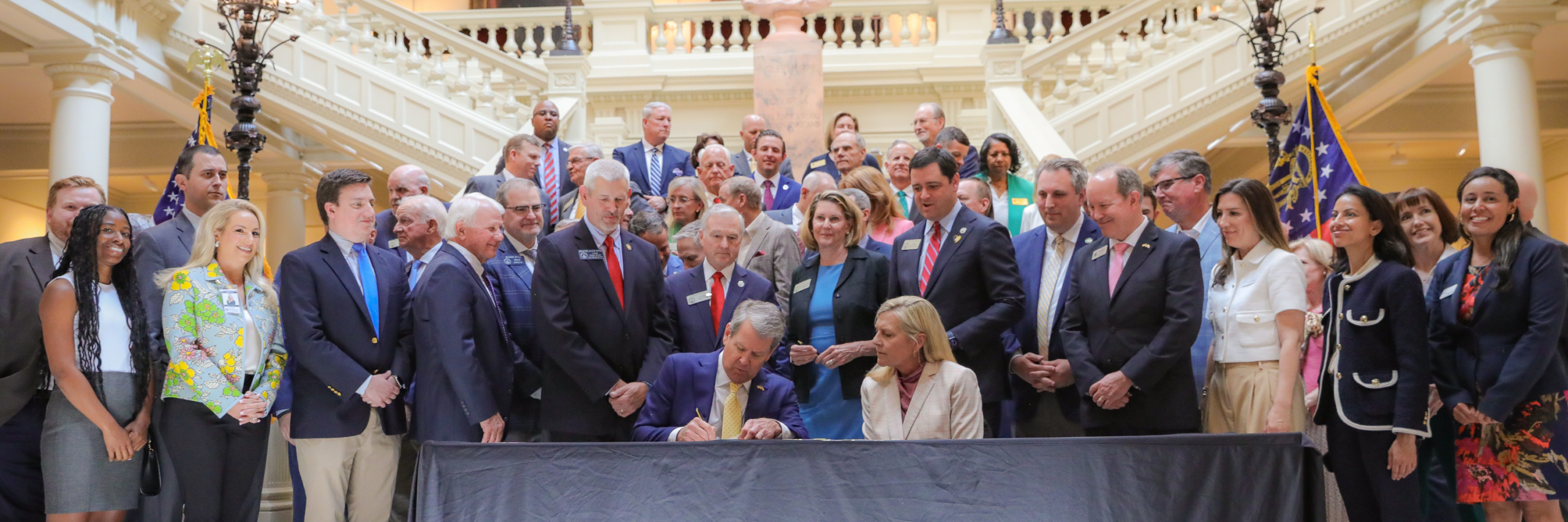 Georgia Governor Brian Kemp signs a bill into law.